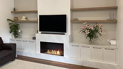 EcoSmart Flex 42SS Fireplace built-in to a private indoor living room, ethanol fuel delivering ventless modern ambience.