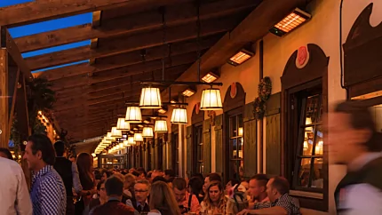 Heatscope Heaters Spot 2800W Radiant Heater wall-mounted in a commercial restaurant, electric infrared outdoor heating enhancing comfort.