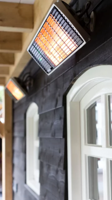 Heatscope Heaters Spot 2800W Radiant Heater wall-mounted outdoors at Commercial Space restaurant, electric infrared patio heating.