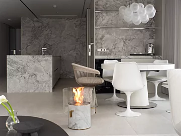 EcoSmart Pillar 3L Designer Fireplace adds elegant marble ethanol warmth to residential dining rooms in South Korea, enhancing modern home ambience.