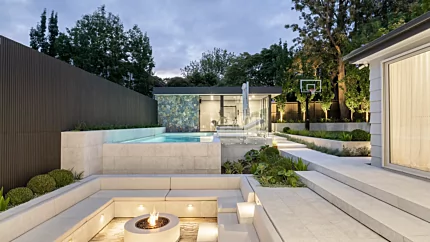 EcoSmart Fire Ark 40 Fire Table creates an inviting fire pit outdoors in the Camberwell Project, finished in bone concrete for year-round living.
