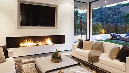 XL900 Ethanol Burner by EcoSmart Fire creates a striking linear fireplace in the Rising Glen living room for sustainable home heating.