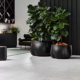 Blinde Design Stitch Series Planter brings modern outdoor planter elegance to the Private Residence patio, framing greenery in sleek concrete.