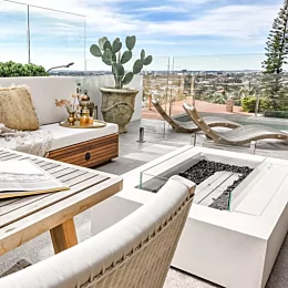 This balcony garden connects the pool, outdoor dining and open
