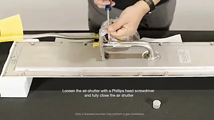 Loosen the air shutter with a Phillips head screwdriver and fully close the air shutter